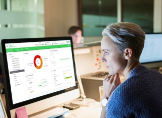 a woman in front of the desktop